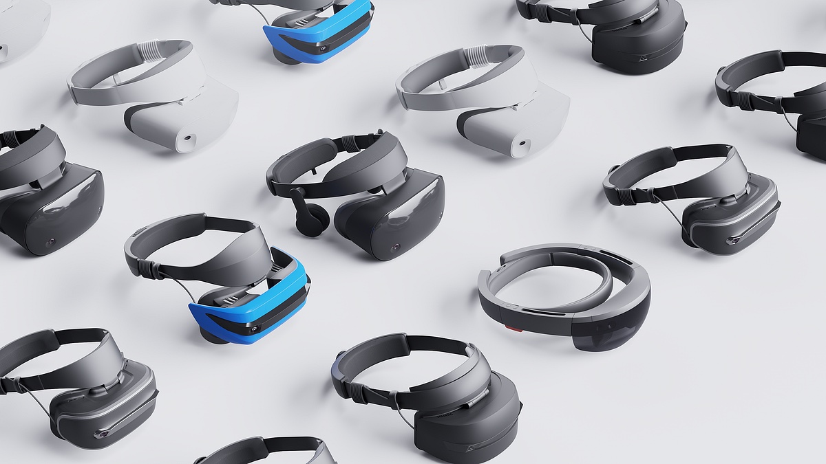 An array of mixed-reality and VR headsets arranged on a plain white surface